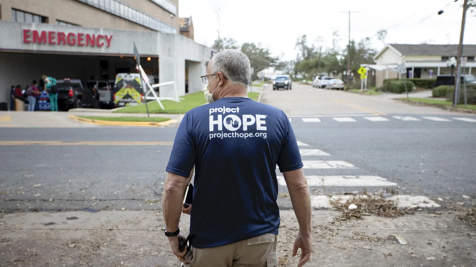 Back of man with Project HOPE shirt on