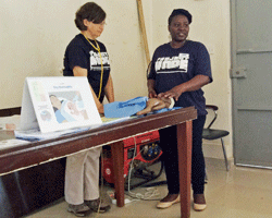Project HOPE volunteer nurse assists in Sierra Leone.