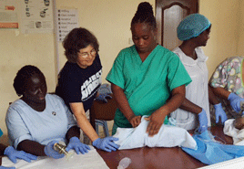 Project HOPE volunteer nurse assists with maternal and newborn health in Sierra Leone.