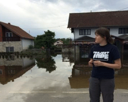 Project HOPE's Country Director for Bosnia and Herzegovina Sejdefa Catic Basic observes the flooding in Orashje