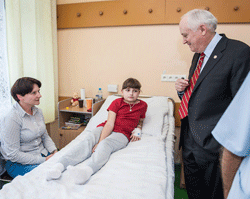 John P. Howe, III, M.D. meets with children at University Children's Hospital of Krakow in October 2013