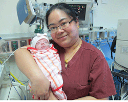 Baby Lily with the nurse who took care of her at Shanghai Children's Medical Center