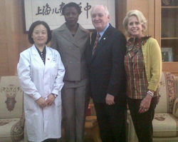 Dr. Ji Quinying, Pfizer Fellow Tanya Owens, Dr. Howe and Tyrrell Flawn