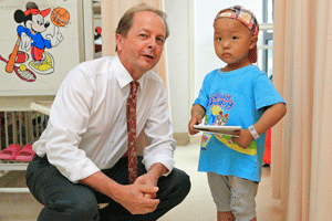 Pediatric cardiovascular surgeon with baby at Shanghai Children's Medical Center