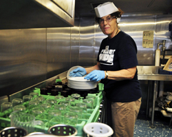 Volunteer Nurse Faye Pyles Organizes Kitchen Duty