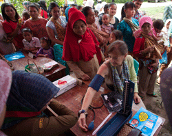 Dr. Joyce Johnson, leader of the delegation, gets her blood pressure checked at a rural health clinic trained by Project HOPE near Serang, Indonesia