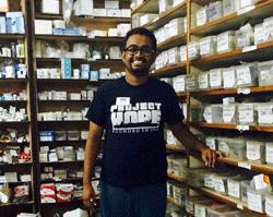 Volunteer Jovin Panthapattu in ASRAM hospital's pharmacy