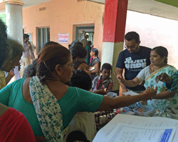 Jovin Panthapattu volunteering at the prescription filling and dispensing station of the medical camp