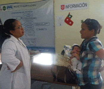 Doctor with mother and baby in Dominican Republic health clinic