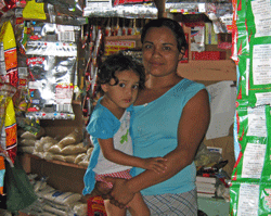 Kelin and one of her children in her grocery busines, the result of Project HOPE village health bank program in Honduras