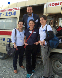 Volunteer nurse Louisa Reade center with Project HOPE staff and fellow volunteer Dr. Corey Kahn at the Gevgelija Transit Center in Macedonia