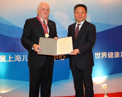 Dr. Howe Receives Magnolia Award from Shen Xiaoming, Vice Mayor of Shanghai