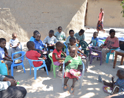 orphans are fed with food paid for by savings from Project HOPE's village savings and loan program 