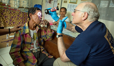 Volunteer Dr. Todd Holzman examines a patient at Tapaz Municipal Hospital