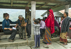 Kathy Pedersen treating patients in Nepal before the earthquake. Photo by Nick Pedersen. 