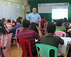 Project HOPE's Abul Hashem presents program development workshop in Myanmar.