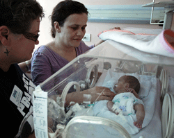 Patti Nicks visits a newborn at University Hospital in Pristina, Kosovo