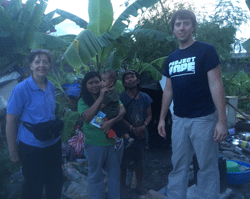 James Calderwood, RN, Project HOPE volunteer with people affected by Typhoon Haiyan in Tacloban, the Philippines