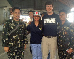 James Calderwood, RN, Project HOPE volunteer with members of the Philippine military on Pacific Partnership 2014