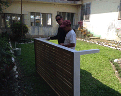 With donated paint from Project HOPE volunteers, beds are painted at Tapaz District Hospital