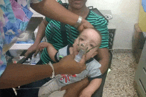 Dominican Republic baby receives respiratory care.