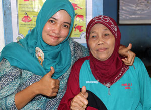 Traditional Birth Attendants and midwives work together to provide healthier births in Indonesia.