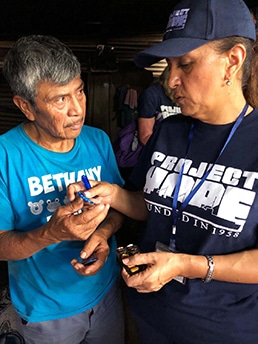 Teresa with patient in Guatemala
