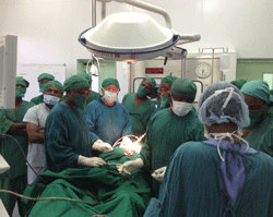 Dr. Robert Baxt provides guidance to Tanzanian surgeons