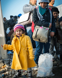 Migrants awaiting entrance into the Gevgelija transit camp