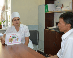 Nurse Marina helps a patient with TB in Uzbekistan