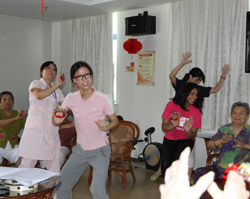 China elder care senior care music therapy class Baxter International Foundation