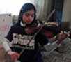Larissa Manrique uses her violin to support HOPE's relief efforts in the Philippines