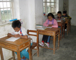 Children in rural China taking a nutrition knowledge survey.