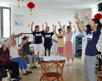 Ms.Tingting  Zhao leading the music exercise class for the seniors at Tangqiao Elderly Community Service Center