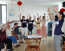 Ms.Tingting Zhao leading the music exercise class for the seniors at Tangqiao Elderly Community Service Center.