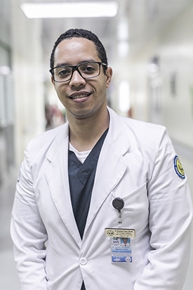 Portrait of a doctor in a white coat at Los Mina hospital in the Dominican Republic.