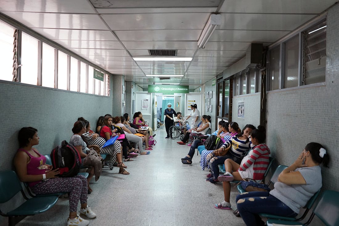 Women waiting in a hospital hallway.
