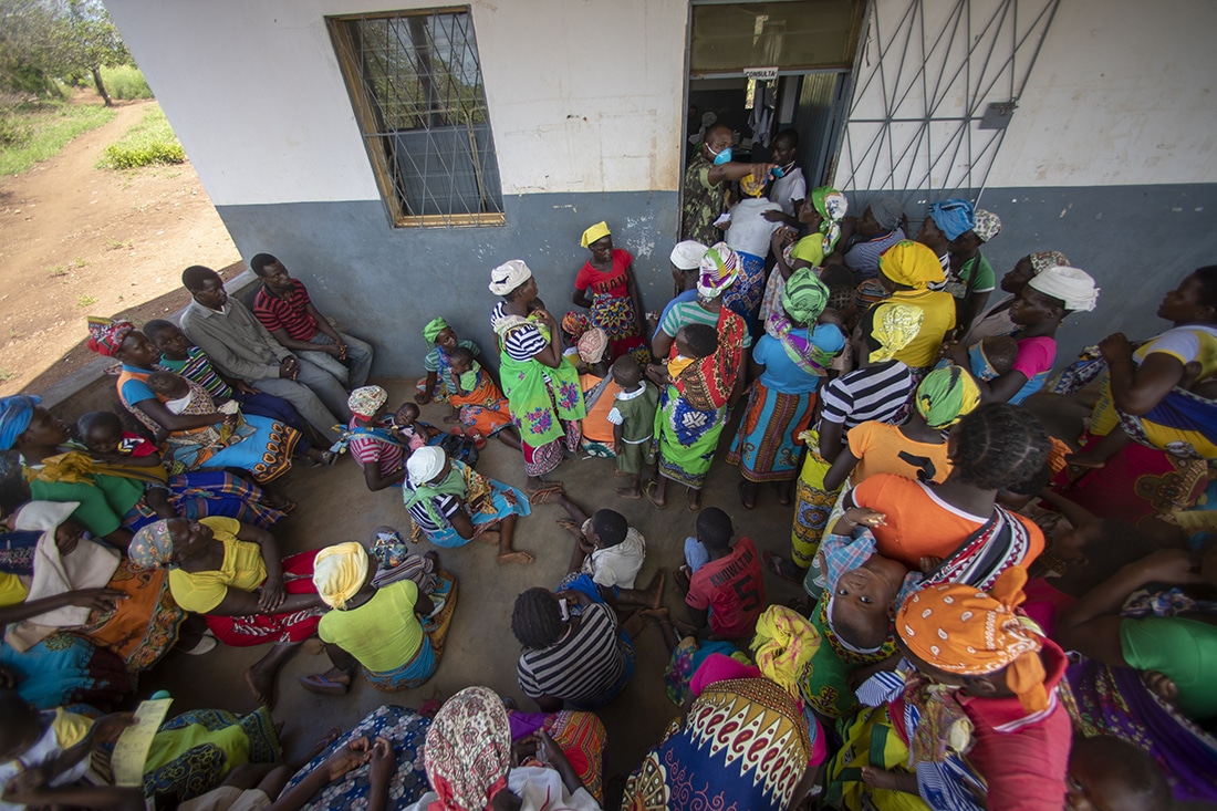 A health clinic in a village is Mozambique is so busy people are waiting outside to be seen