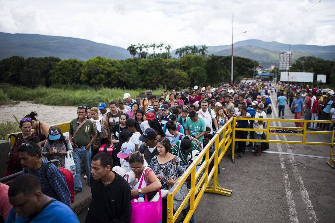 People in line to cross the border from Venezuela to Colombia. 