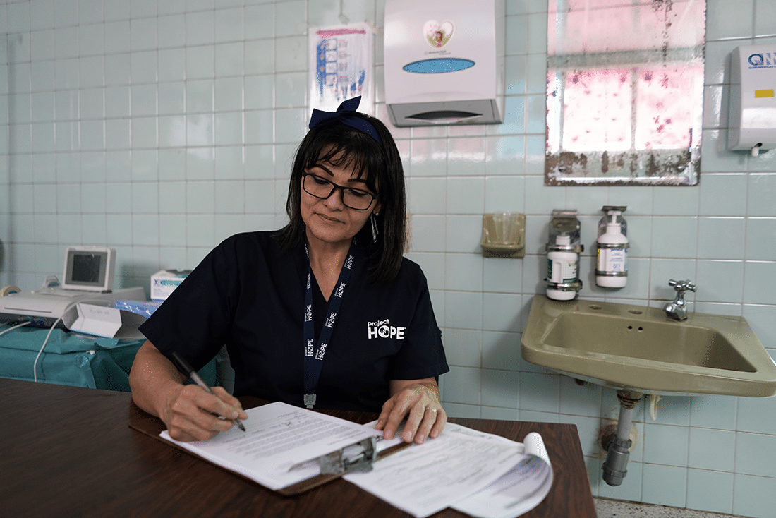 Nurse doing paperwork in the hospital.