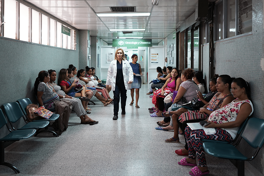 Women waiting to be seen by a doctor line the hallways of Erasmo Meoz Hospital in Cúcuta Colombia.