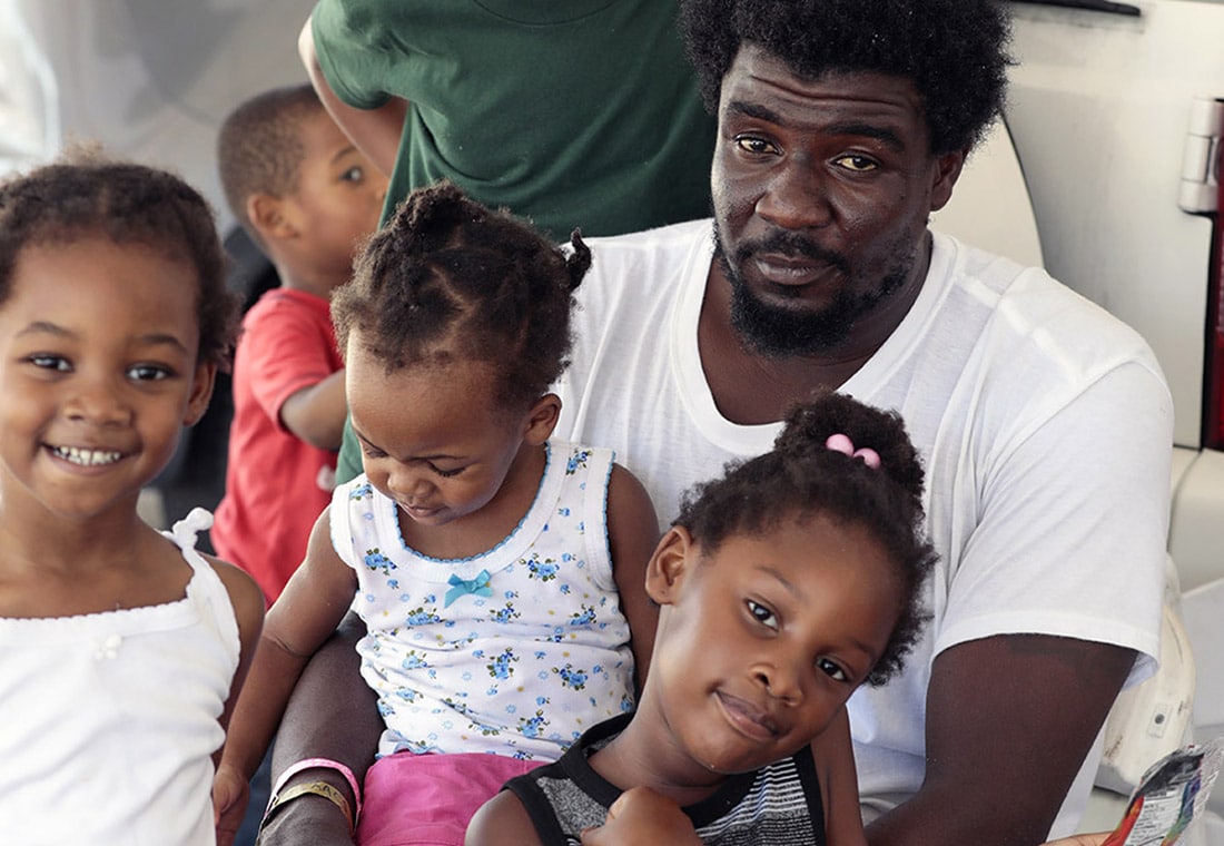 Family in a shelter after Hurricane Dorian on the Bahamas