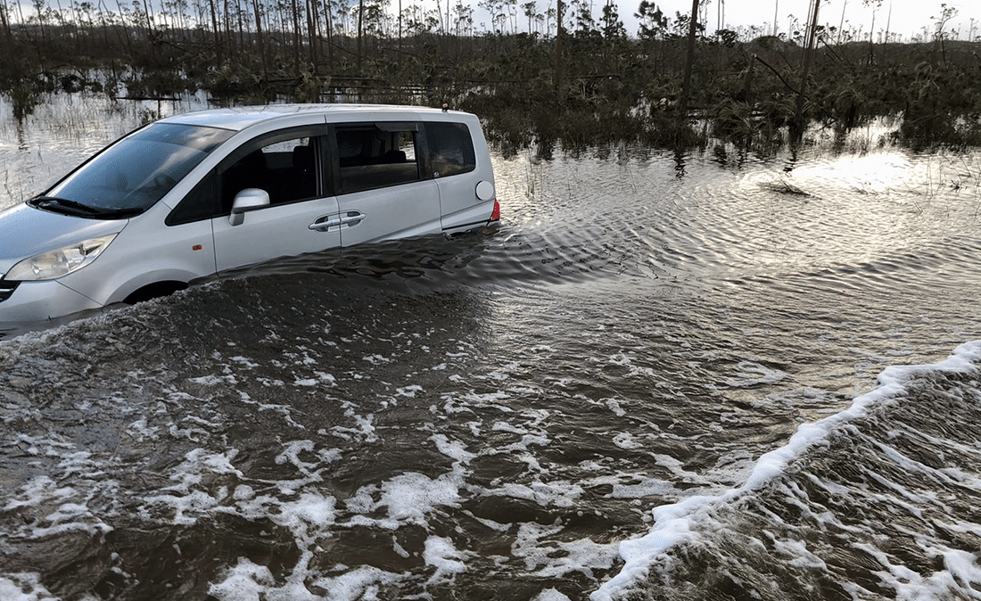 Car in deep water caused by flooding.