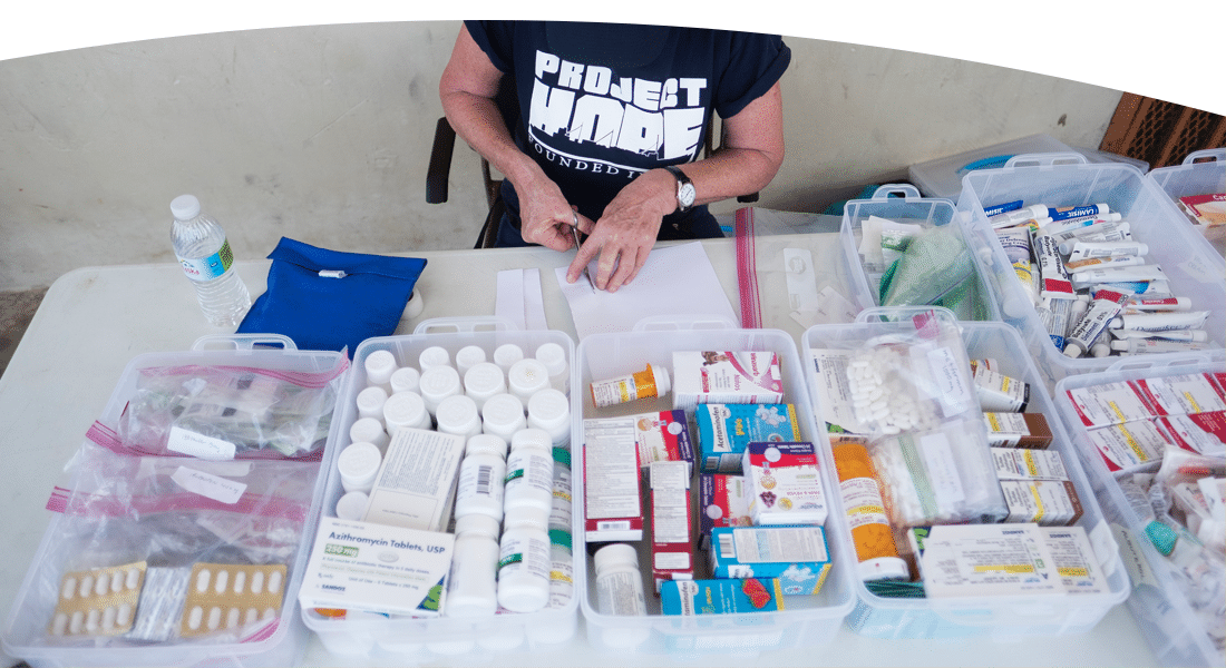 Nurse sorting through donated medicines in Puerto Rico after hurricane Maria.