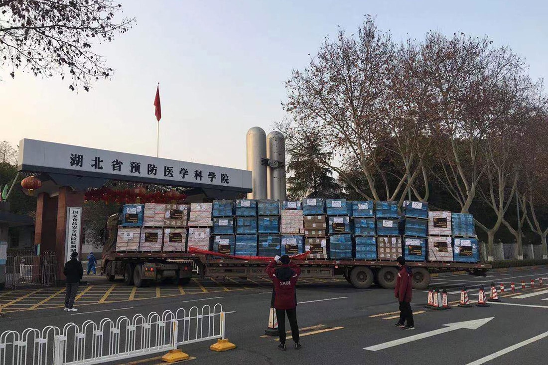 A truck loaded with shipment arrives at a China hospital.