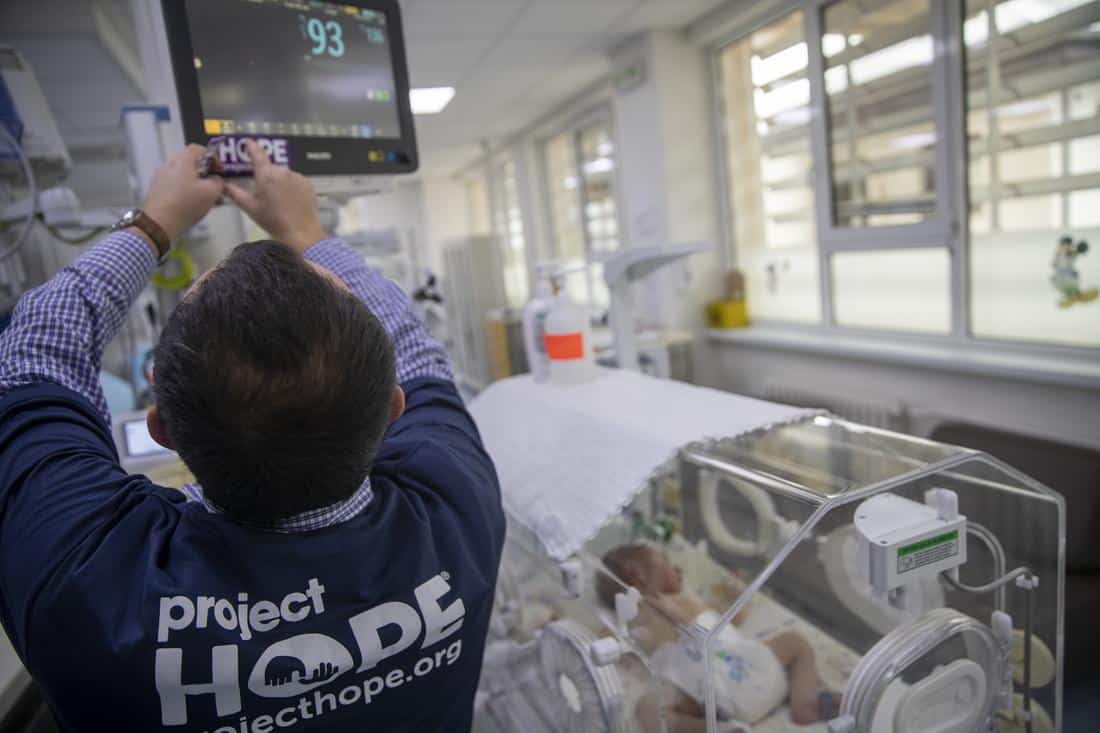 Project HOPE staff member with neonatal equipment