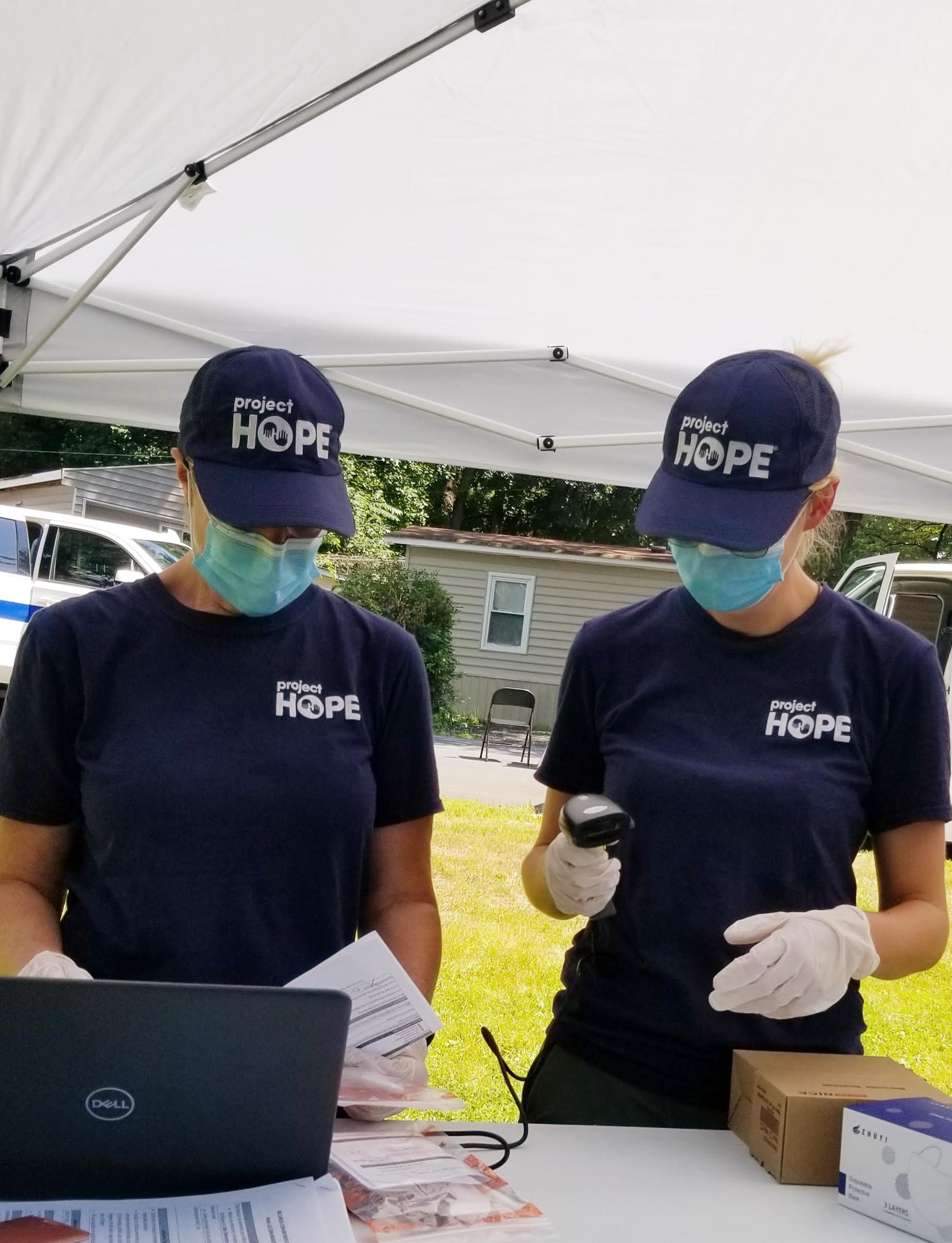 Project HOPE volunteers conduct COVID-19 testing