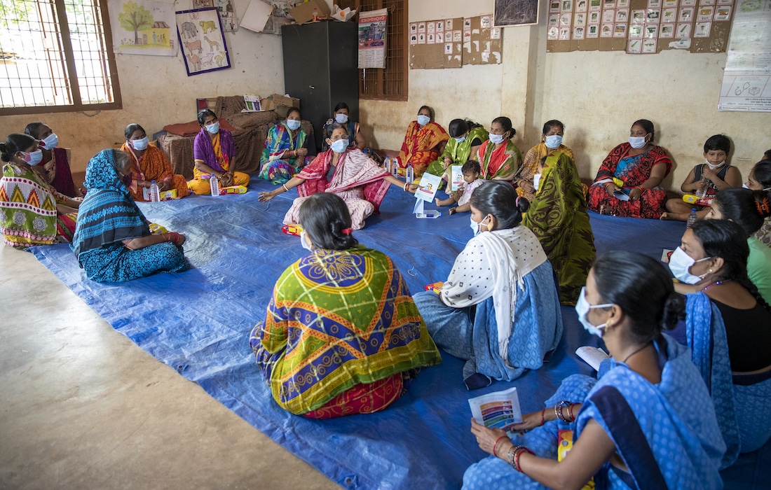 Women's group learning COVID awareness in India