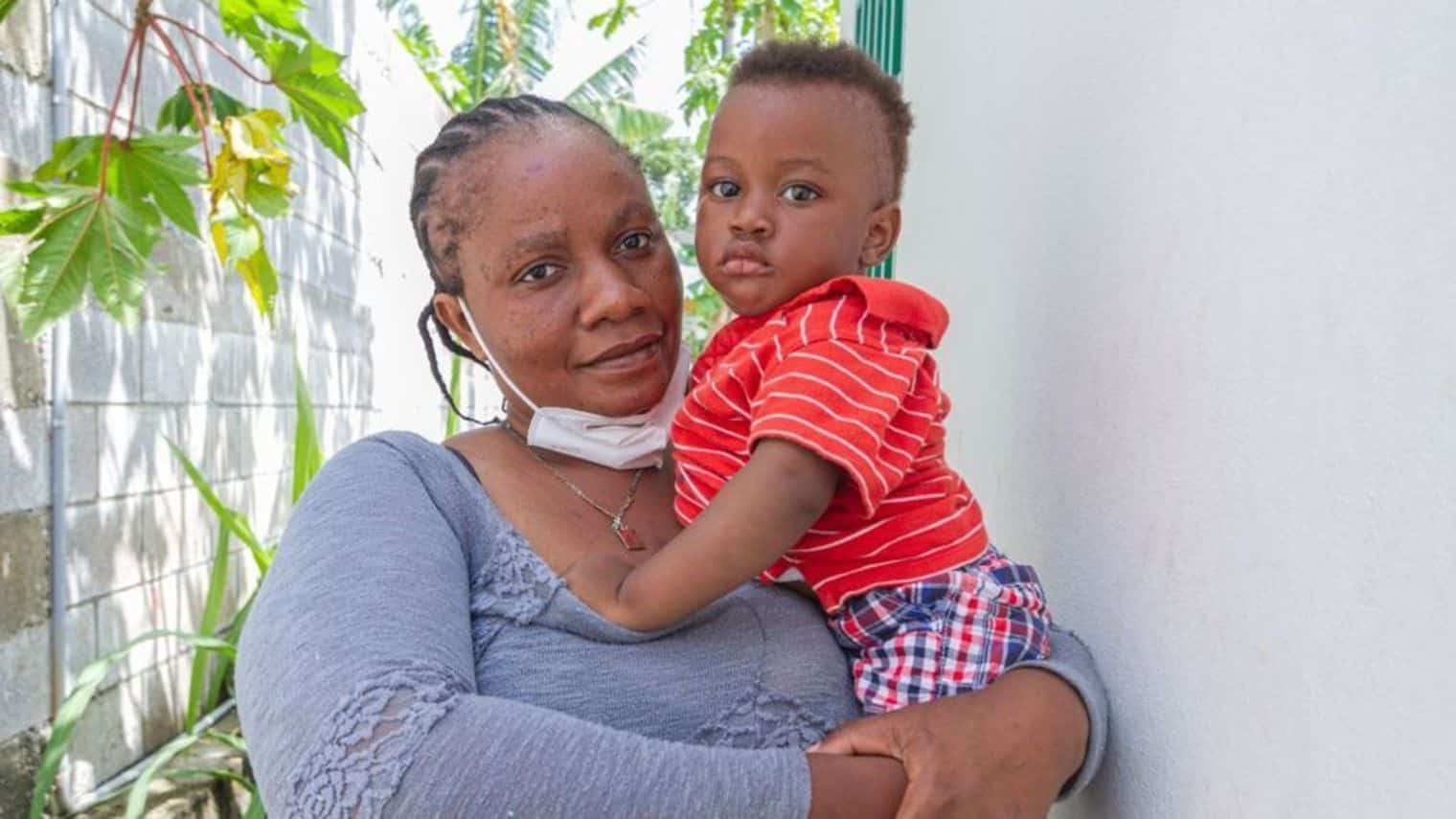 Kerlande Guichette and her son in Haiti