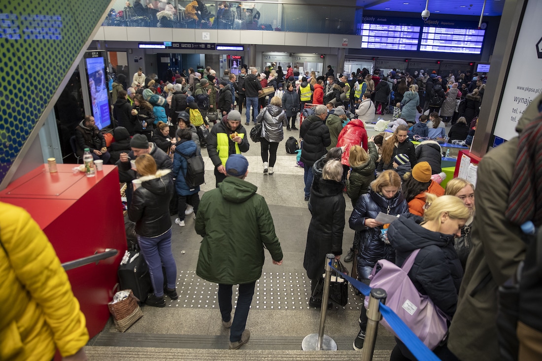 Refugees crowd in a Krakow train station